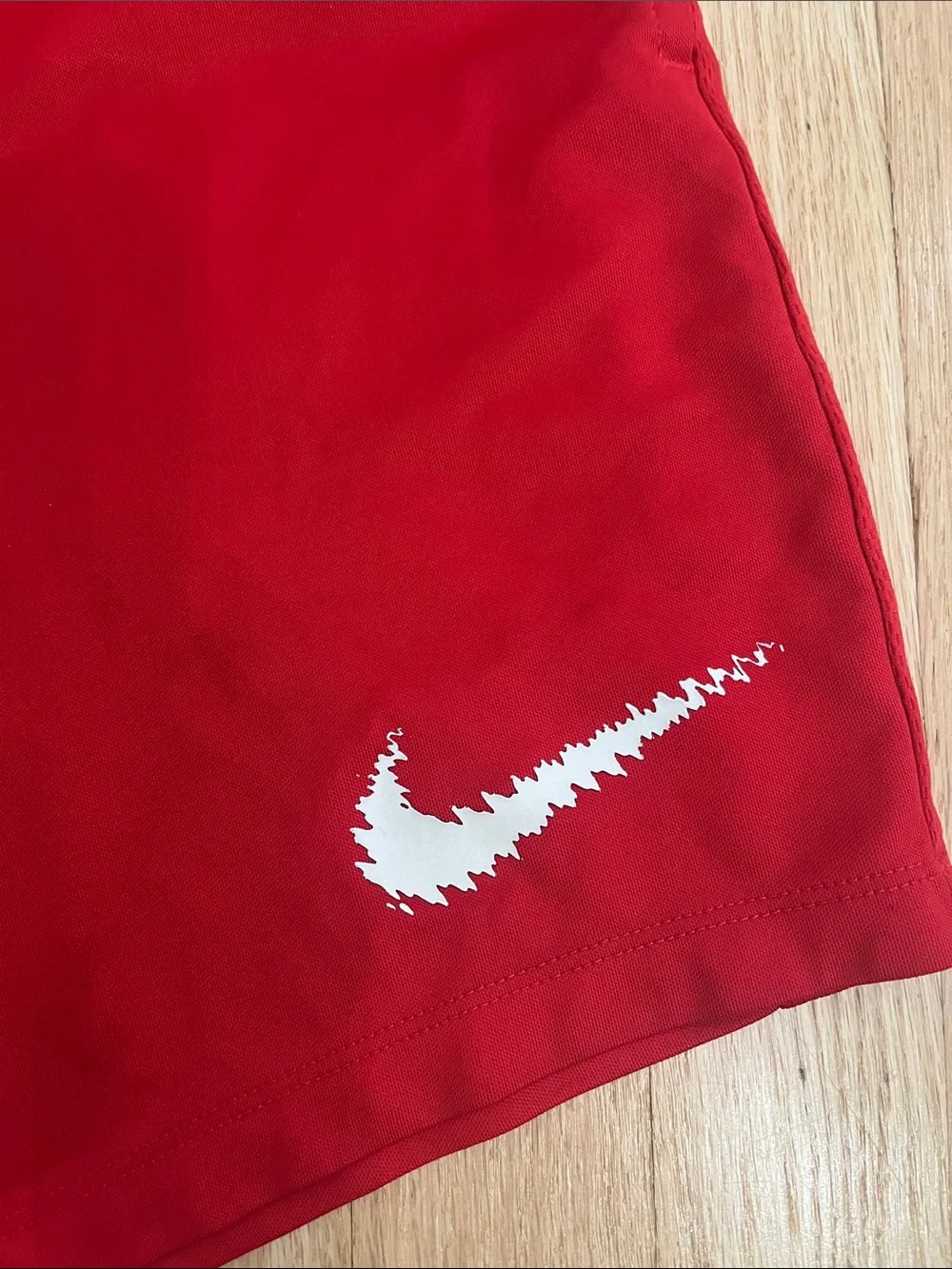 Nike Red Athletic Shorts with White Swoosh